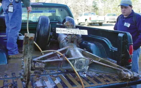 Pat Adkins standing in truck bed hoses mud off of Columbia s nose landing - фото 54