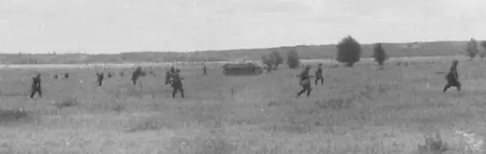 German infantry supported by an assault gun advancing in open order in the - фото 22