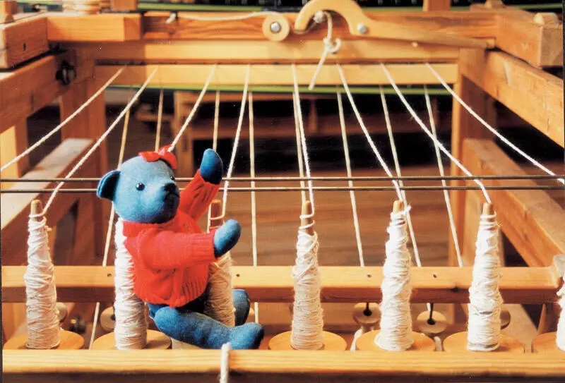 The spun yarn is taken from the spool using a hank winder and shaped into - фото 14