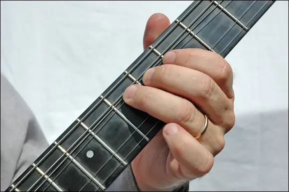 FIGURE 26A lefthand string bend stretches the string causing it to rise in - фото 40