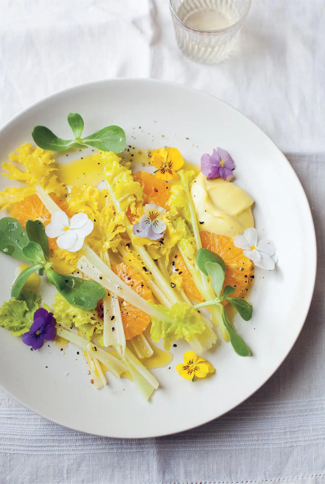AN EARLY SPRING SALAD OF SEA KALE WITH VIOLA FLOWERS ORANGE PURSLANE AND - фото 9