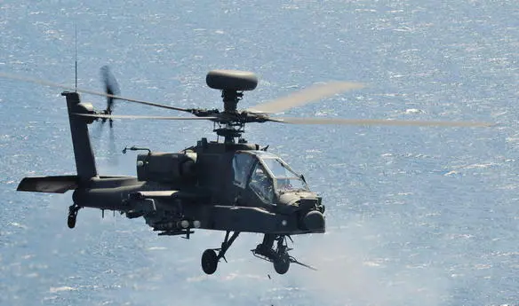 An Apache fires its 30mm cannon on a high seas range The spent shells can be - фото 17