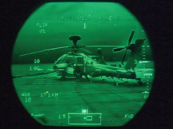 An Apache sits ready on deck at night as seen through the infrared right eye - фото 21