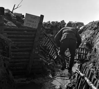 Soldier moving carefully in a trench The sign says Beware of the - фото 23