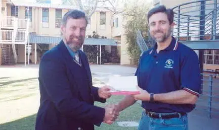 Presenting a 1000 schoolbook voucher from the ADC to Chris Tudor left St - фото 36