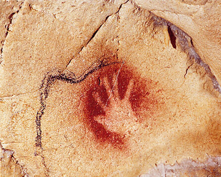 1 A human handprint made about 30000 years ago on the wall of the - фото 1