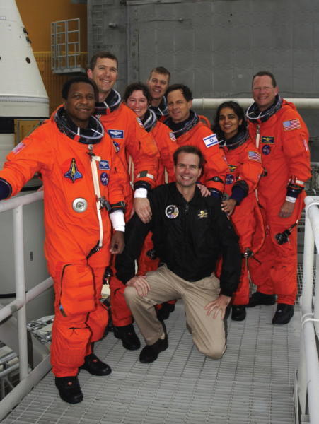 The STS107 crew poses with Robert Hanley kneeling at the completion of the - фото 31