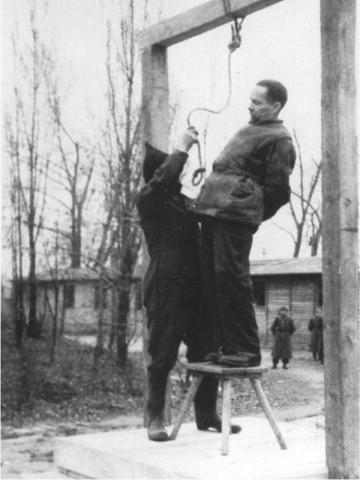 The AuschwitzBirkenau Commandant Rudolf Höss moments before his execution - фото 18